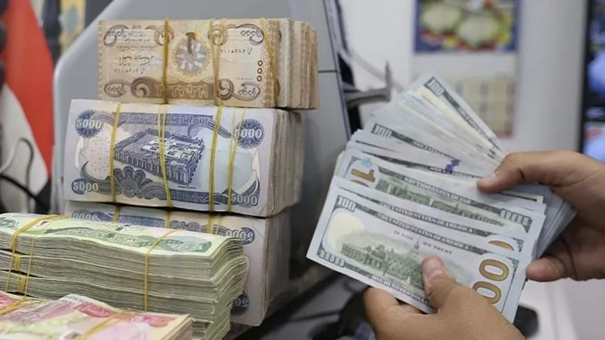 Dollar rate in Baghdad and Erbil falls to about 165,000 dinars per 100 dollars